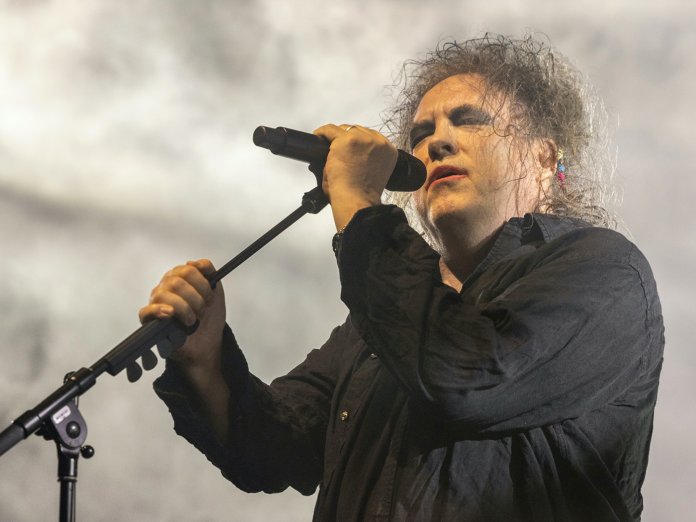 Robert Smith performing live on-stage with The Cure in 2022